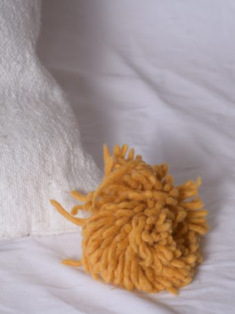 White Moroccan Pillow with Strips and PomPom