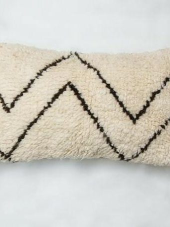 Creamy Moroccan Pillow with black zigzag pattern and PomPom